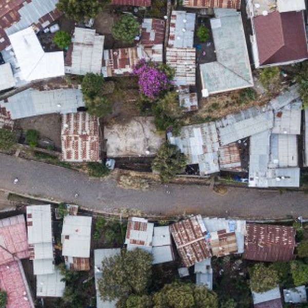 birds-eye-view of a city road with buildings on either side.