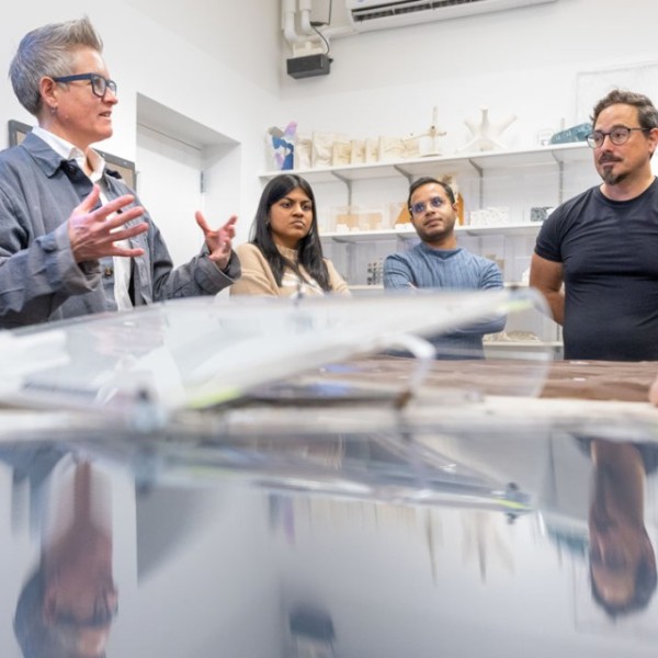 Researchers discussing the development of HelioSkin