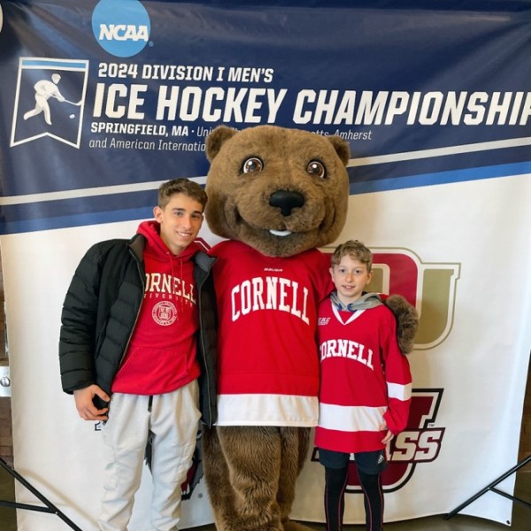 Incoming student, Scott Zinman, poses with Touchdown the Big Red Bear
