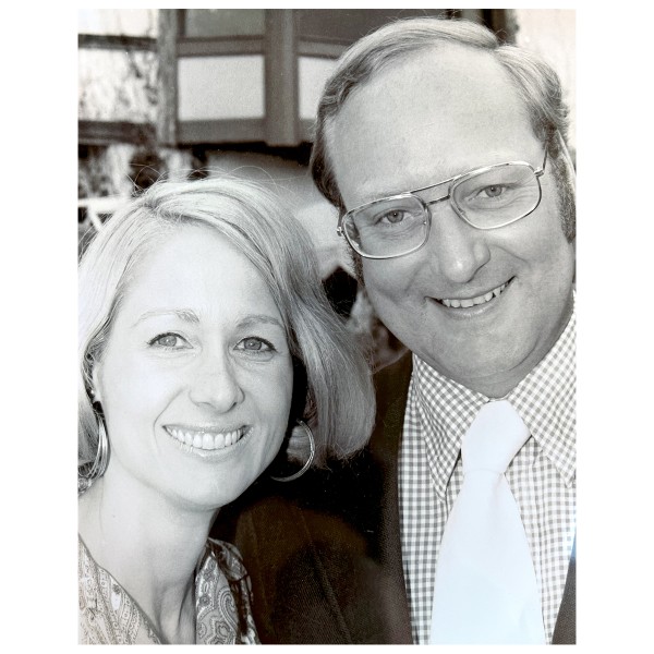 man and woman smiling