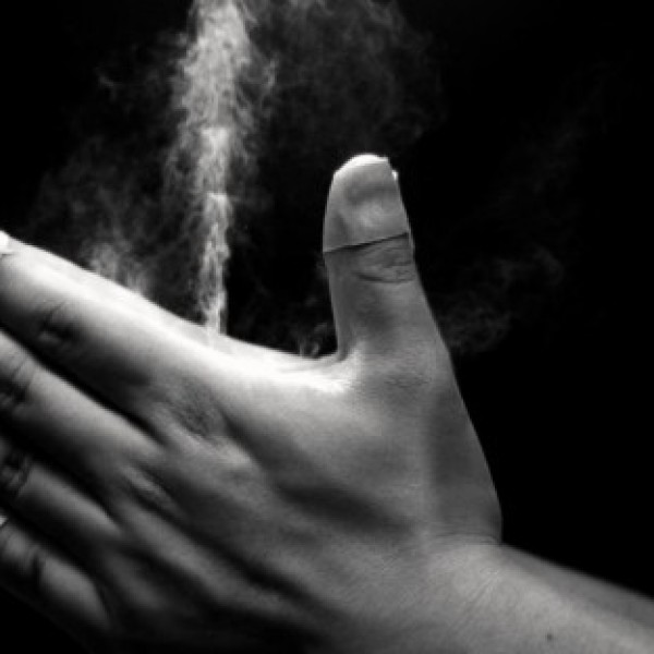 Close up of hands clapping with chalk 