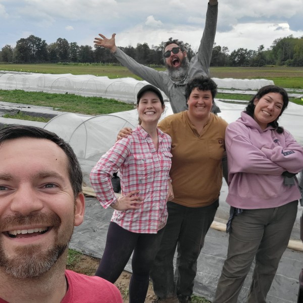 Sean enjoys working in the field with his lab team members.