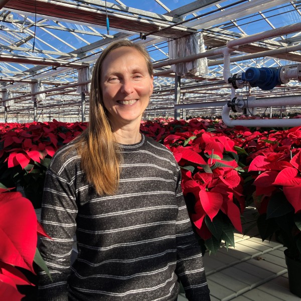 Nora Catlin in a greenhouse.