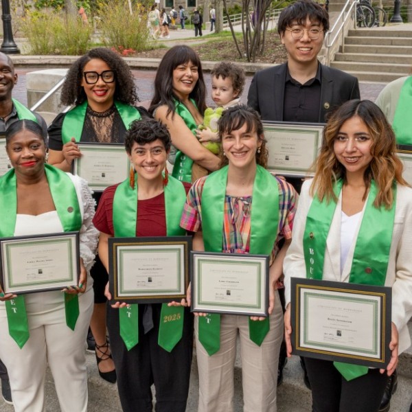 alt="Cornell's nine 2025 Bouchet Scholars with one of the scholar's sons"