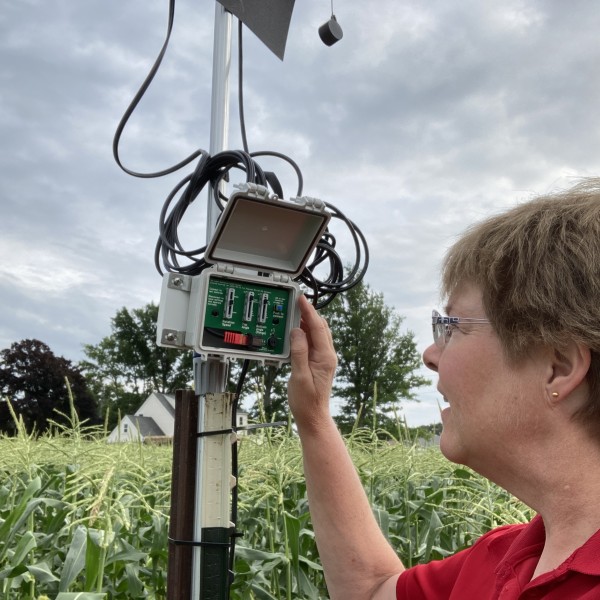 Julie checking a field monitor