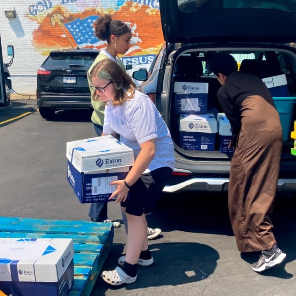 Students from Global Concepts Charter School in Lackawanna, New York, drop off donations they collected for Hearts for the Homeless, a local nonprofit that feeds and clothes the homeless, on June 4.