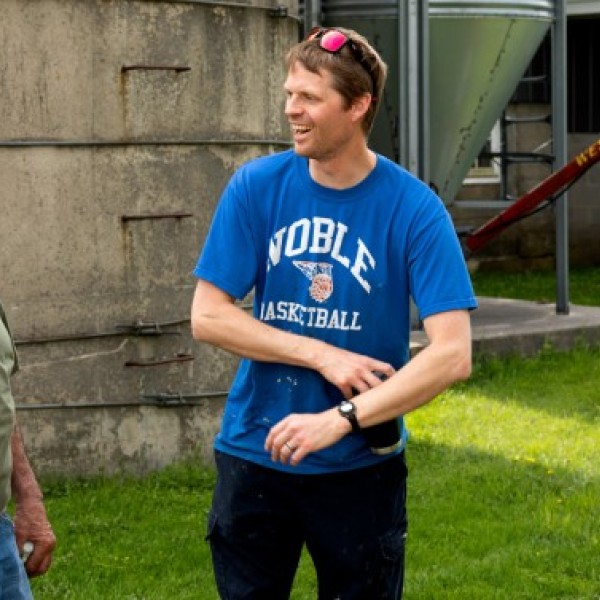 David Hawthorne, left, owner of Centerdale Farm in Black River, New York, speaks with Ben Groen, a former mentee of Hawthorne’s through the AgVets program.