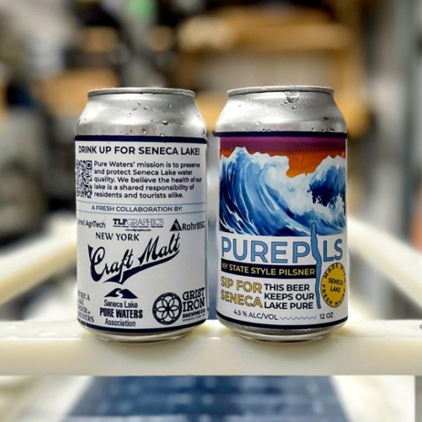Two cans of Pure Brew on an assembly line 