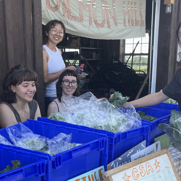 Students around bins of fresh produce