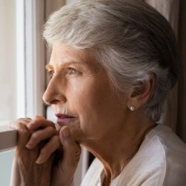 Old woman looking out of the window