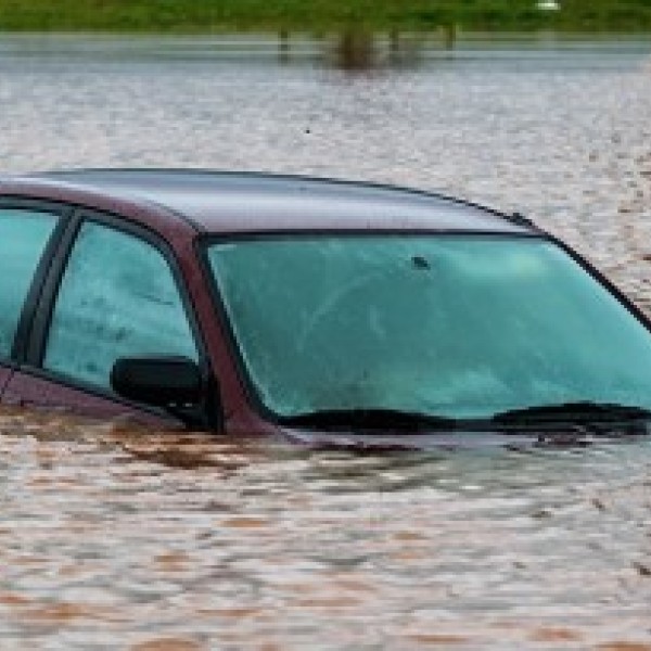Car submerged under flooding waters