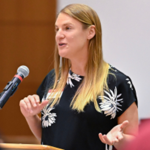 Margaret Frank speaking at an event