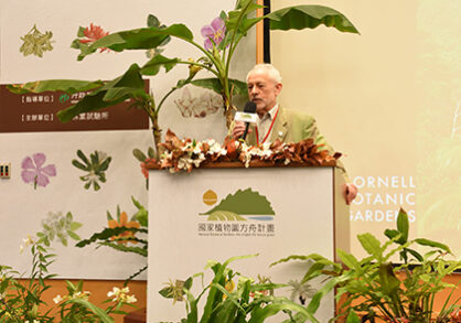 Speaker behind podium at plant conference