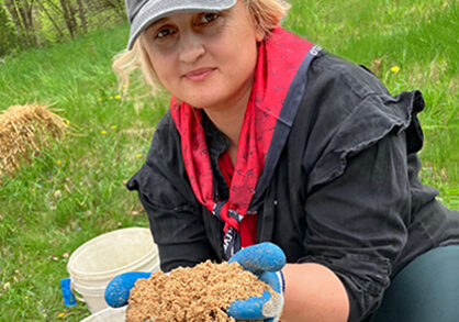 Woman holding plant material