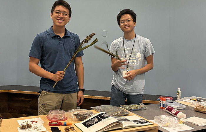 Two students at a table.